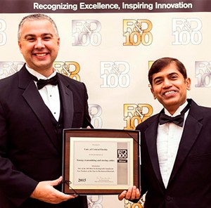 (from left) - Rob Bernath, business development manager at the UCF Office of Technology Transfer, and Jayan Thomas, UCF researcher, accept the R&D 100 Award honoring excellence in technology innovations at the annual awards banquet in Las Vegas.