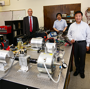 Maglev Chief Financial Officer Martin Epstein and UCF College of Engineering & Computer Science Professors Louis Chow and Thomas Wu with research equipment in Wu's lab